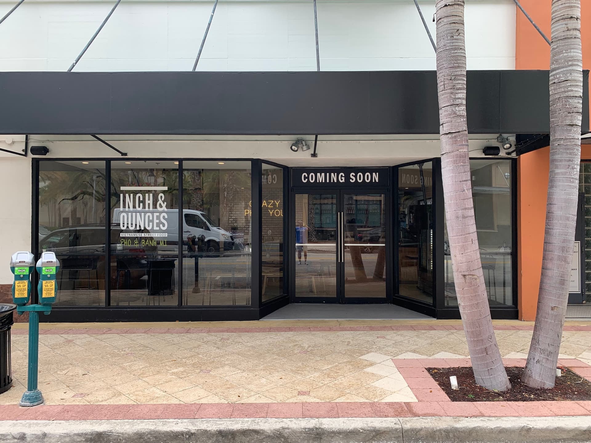A West Palm Beach storefront with the sign band above the windows still blank